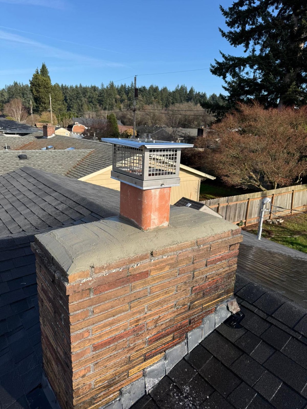 Stainless cap installed on a rebuilt crown, clear day
